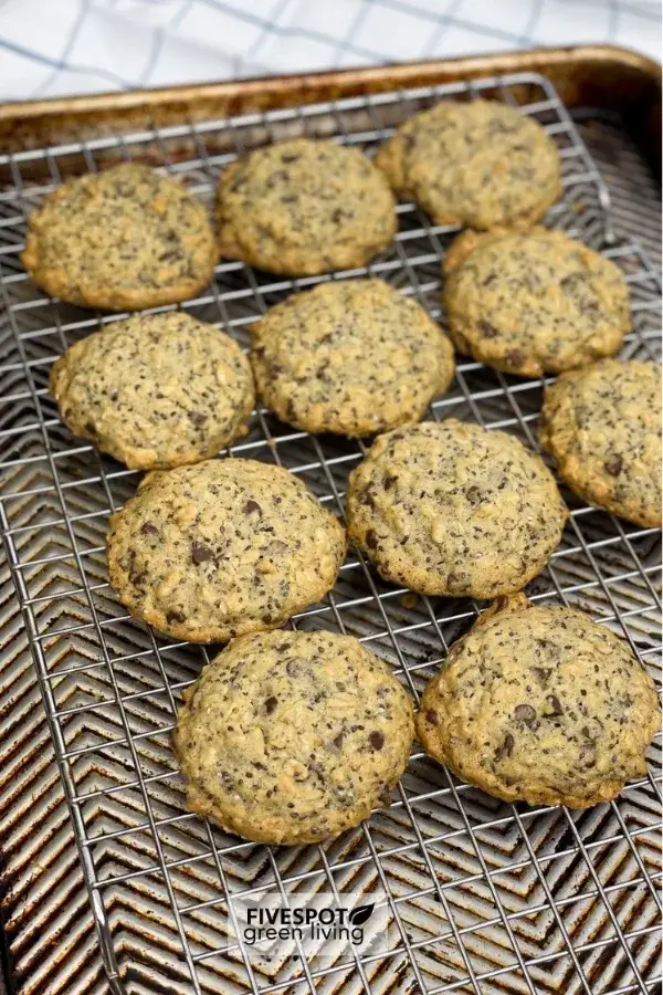 A batch of oatmeal cookies cooling on a wire rack, showcasing their golden-brown color and hearty texture