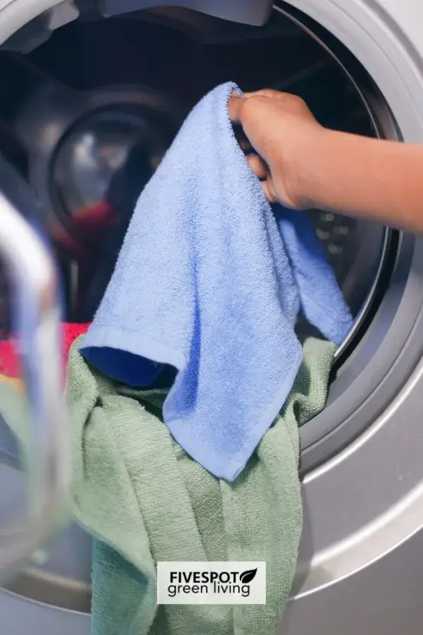 Laundry inside a dryer, illustrating the routine of household chores and a focus on maintaining a tidy, organized home environment.