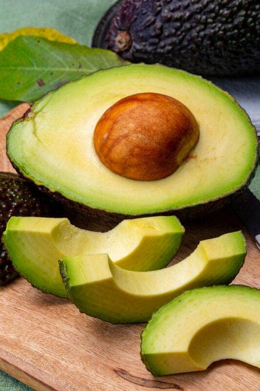 avocado cut on cutting board