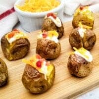 baked potato bites appetizer on board with towel